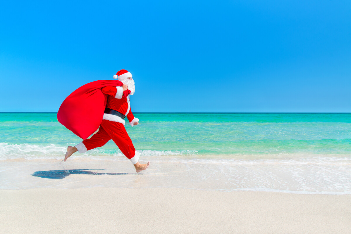 santa running across the beach