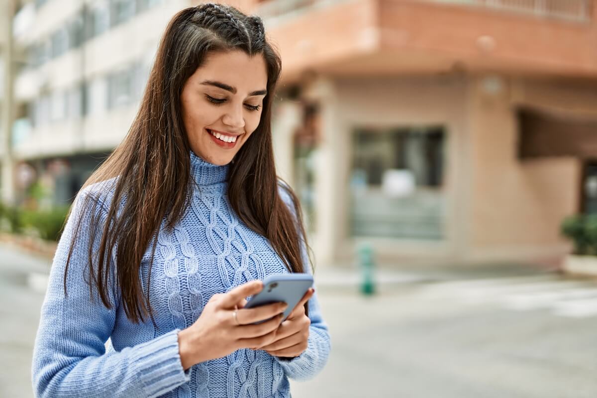 sweater woman sending text