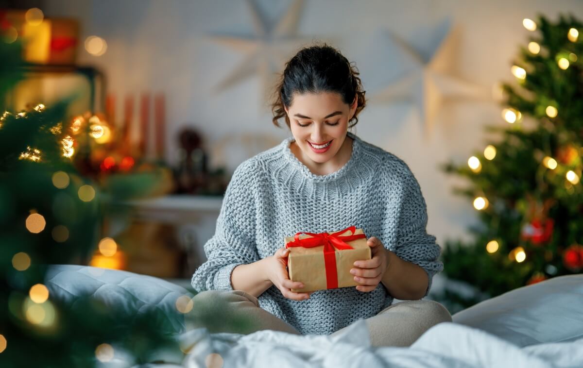 woman holding a christmas gift
