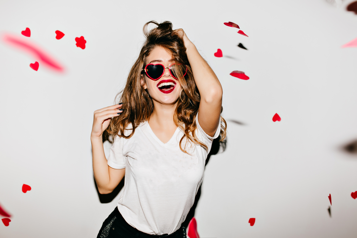 young woman partying with confetti