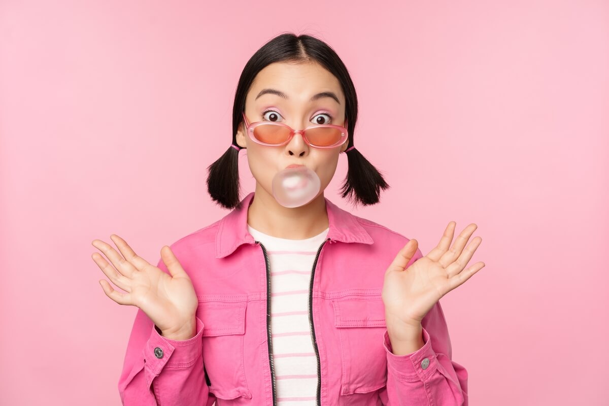 pink girl blowing bubblegum