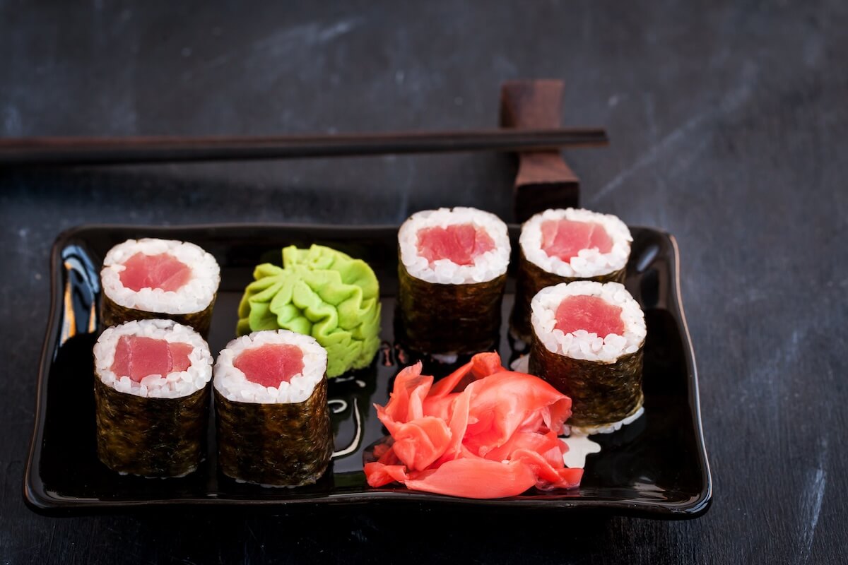 Shutterstock: Fresh delicious tuna maki sushi rolls on dark background, japanese food