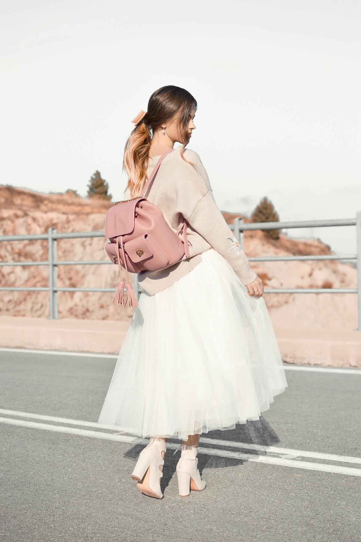 Unsplash: Woman in frilly skirt by Tamara Bellis