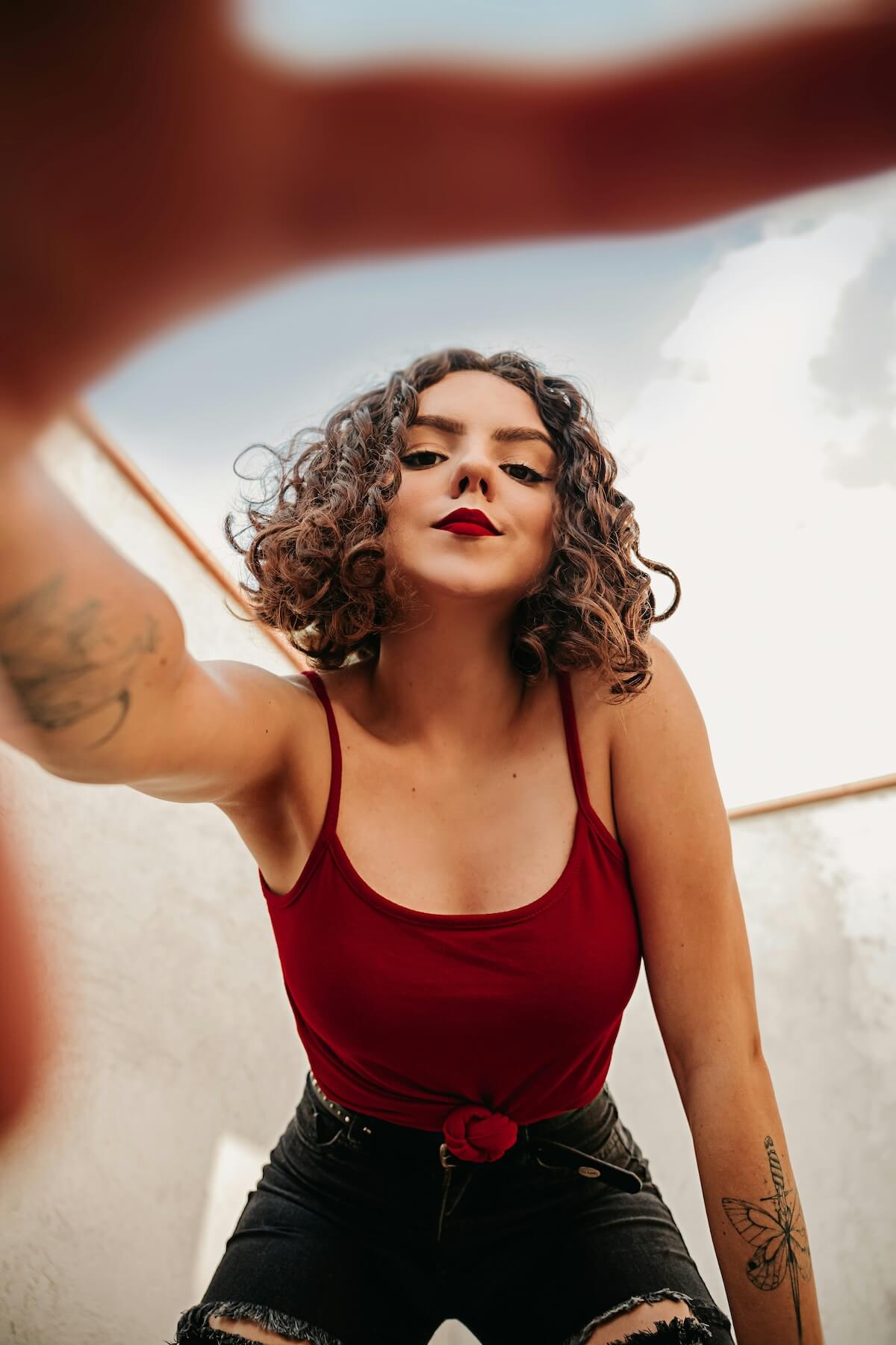 Unsplash: Woman taking confident selfie by Stephany Loreana