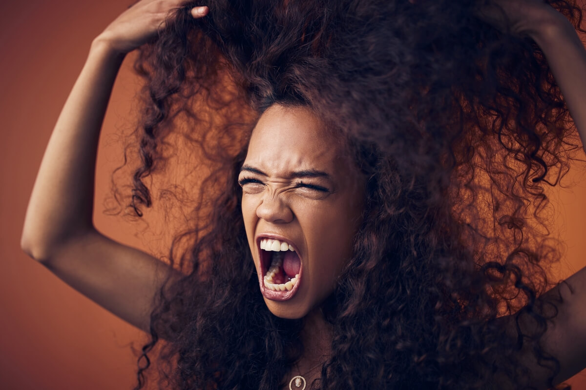 woman angry at curly hair