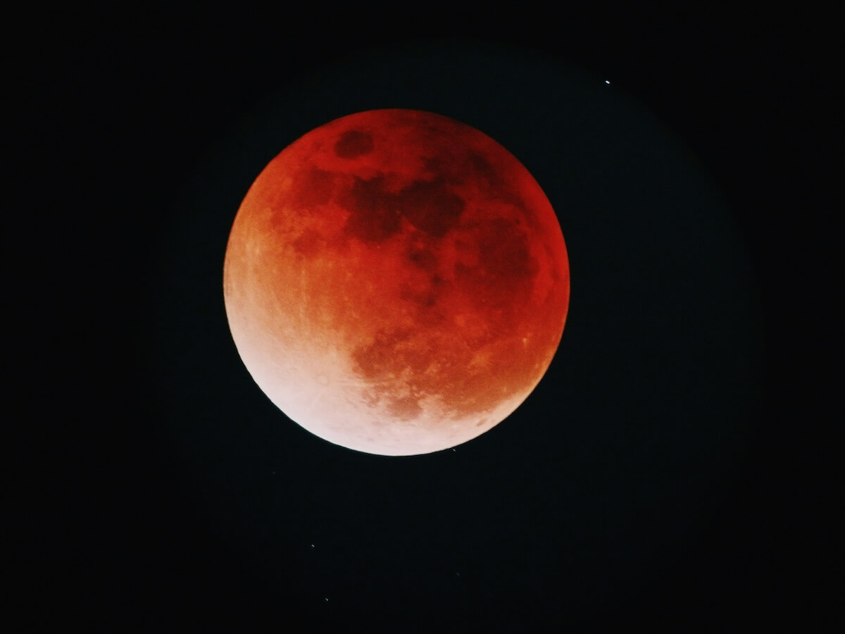 Unsplash: Vibrant full blood moon in night sky by yu kato