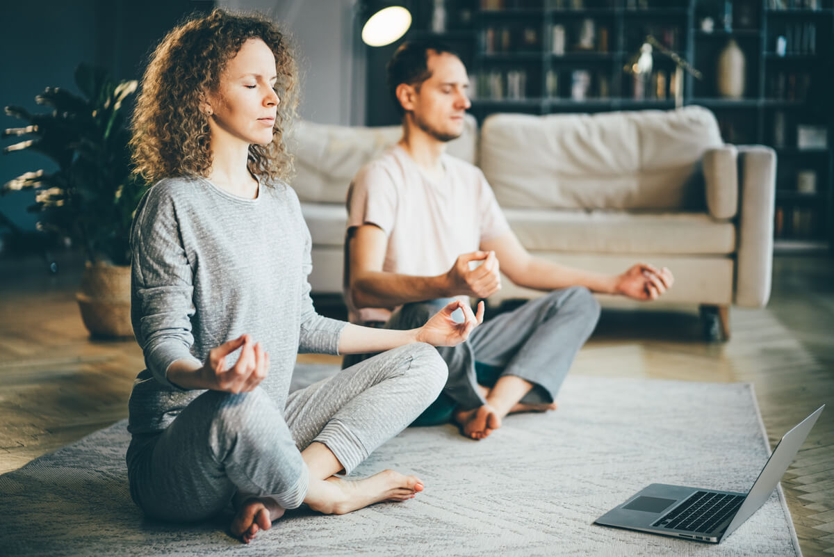 couple doing yoga indoors