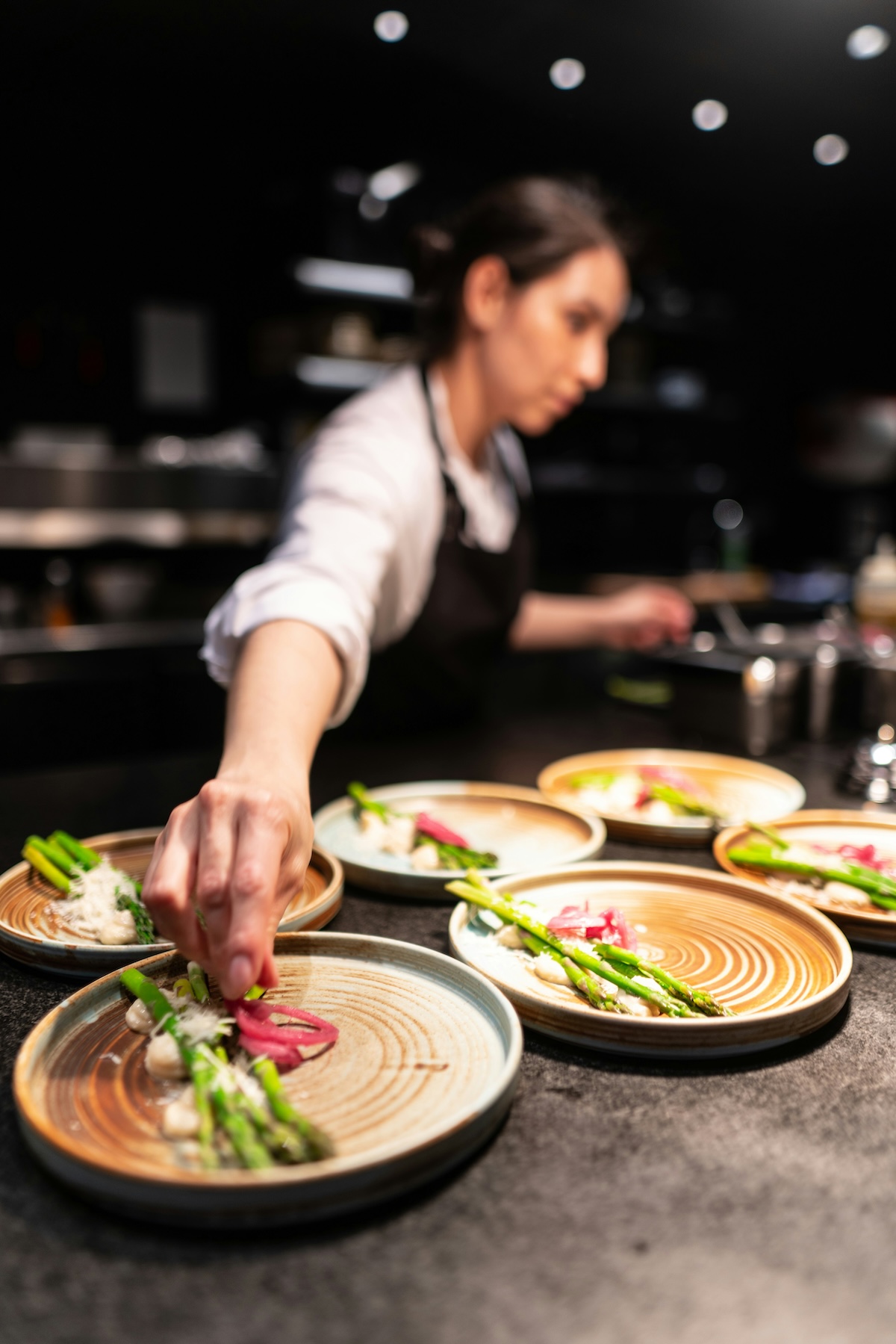 Unsplash: Chef plating asparagus by john fornander
