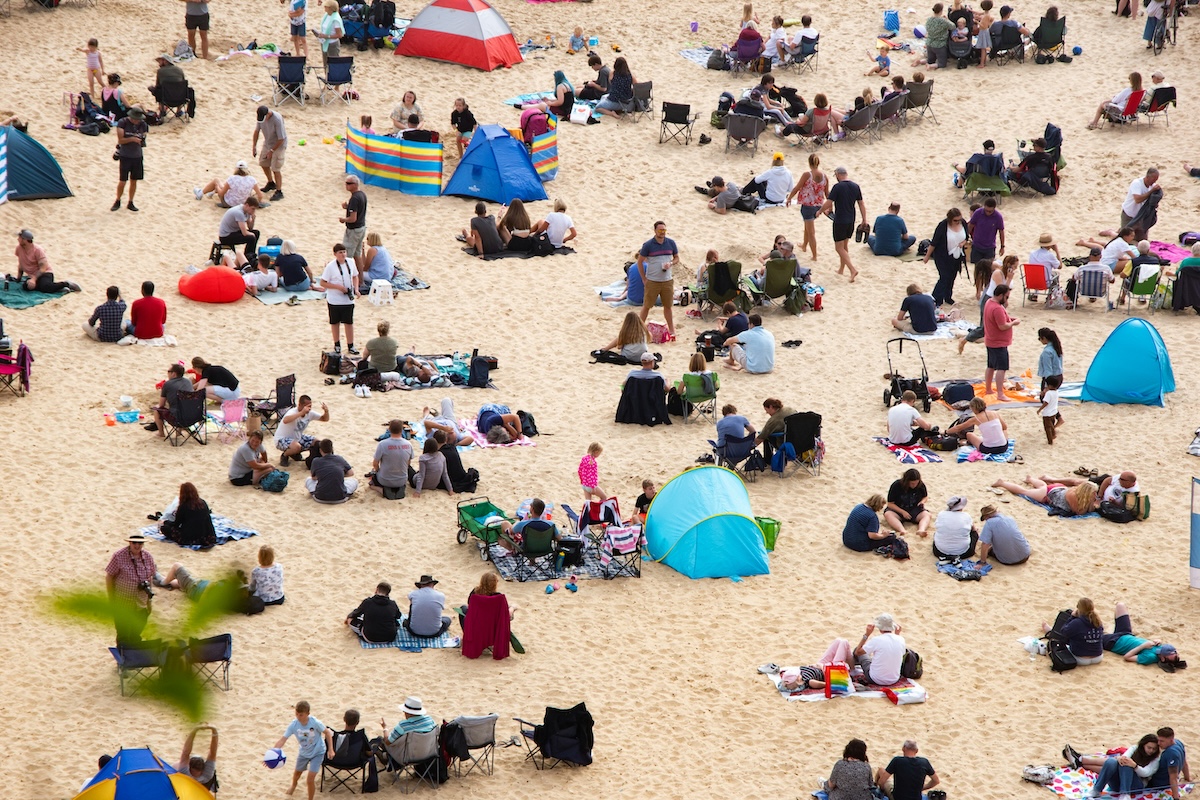 Unsplash: Crowded beach by pete f