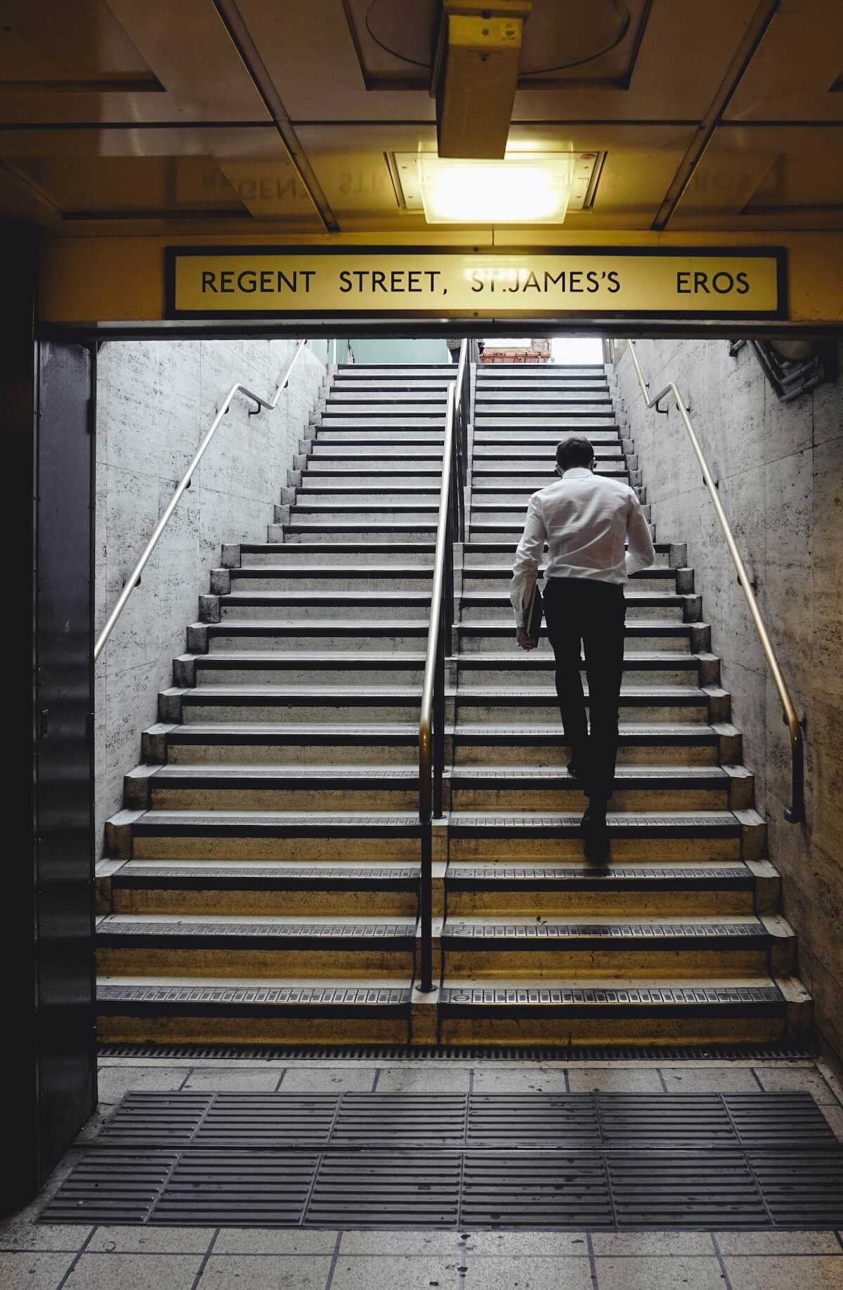 Unsplash: Man taking tube stairs by nonsap visuals