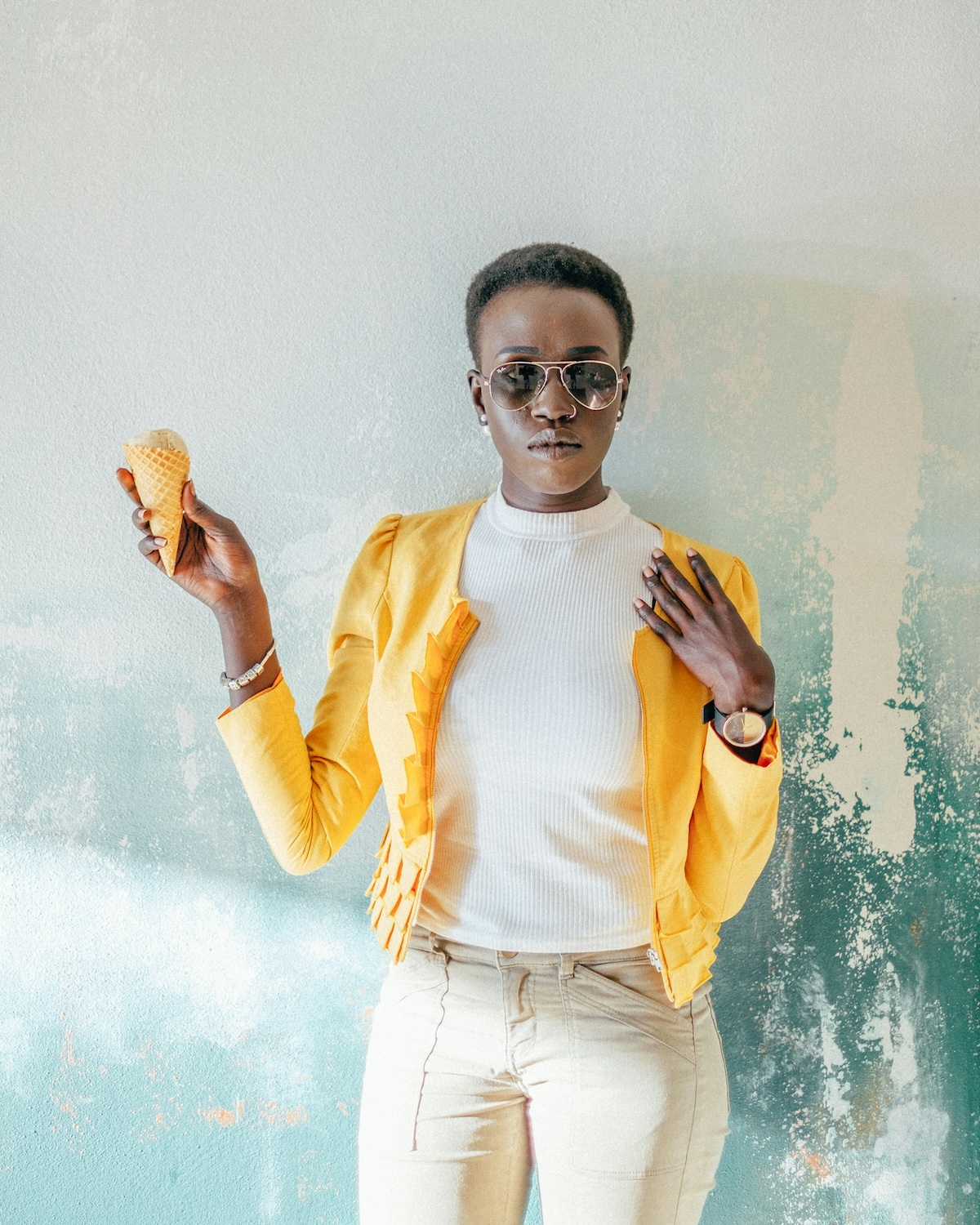 Unsplash: Stylish woman in yellow jacket with ice cream by alvin