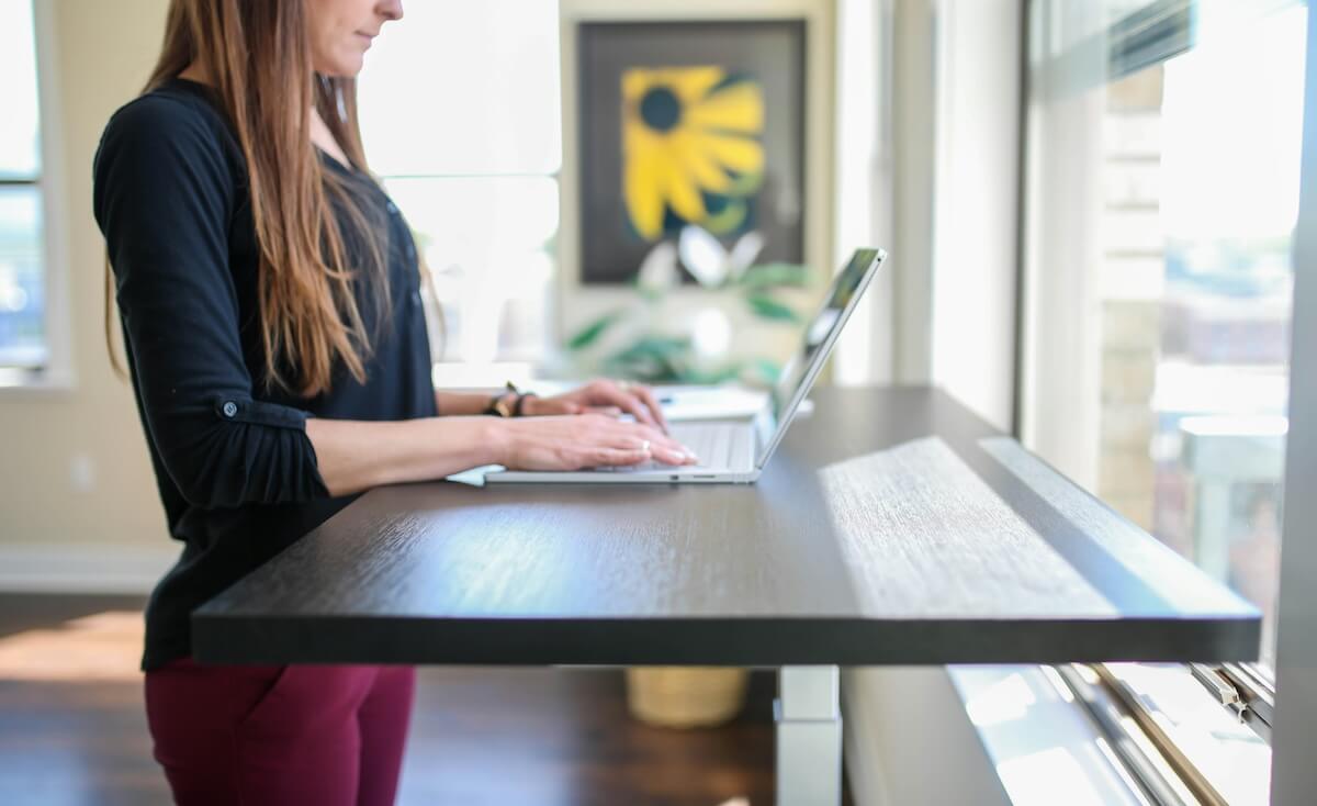 Unsplash: Woman at standing desk by thestandingdesk