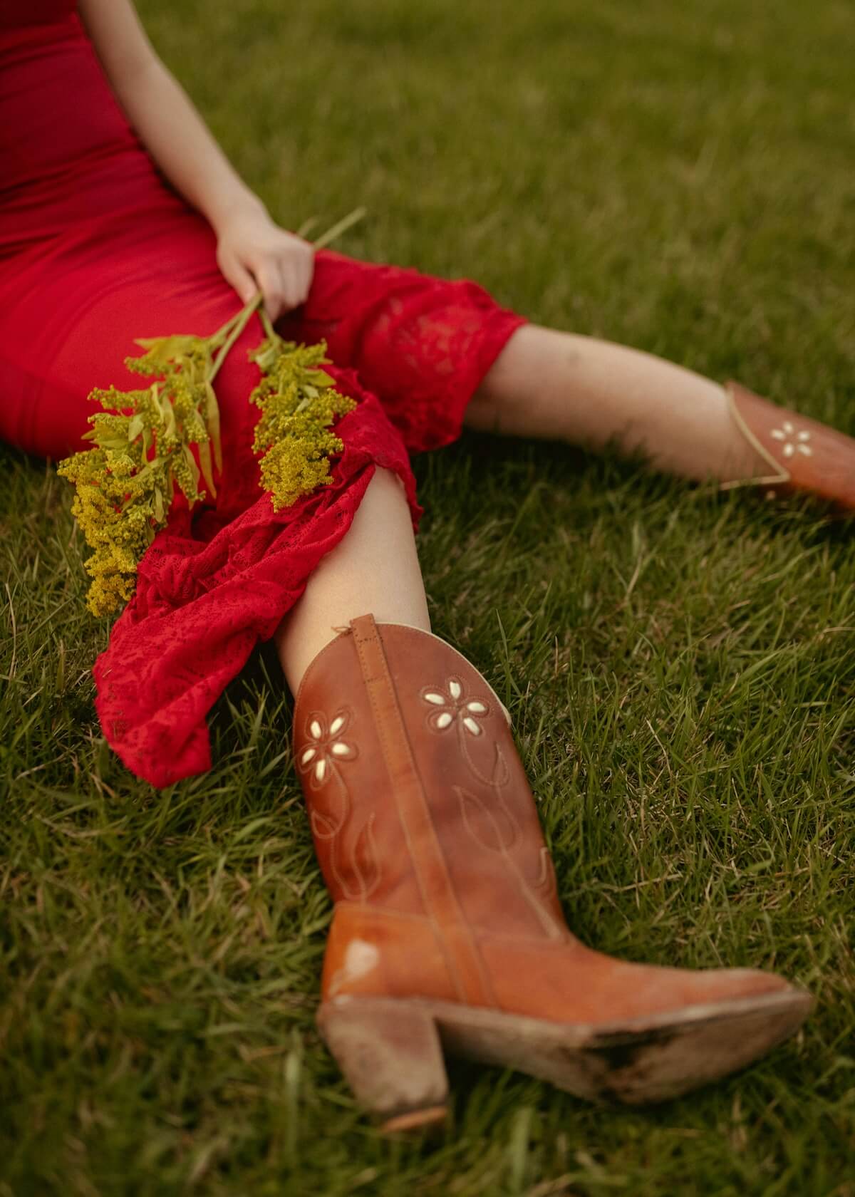 Unsplash: Woman in brown cowboy boots