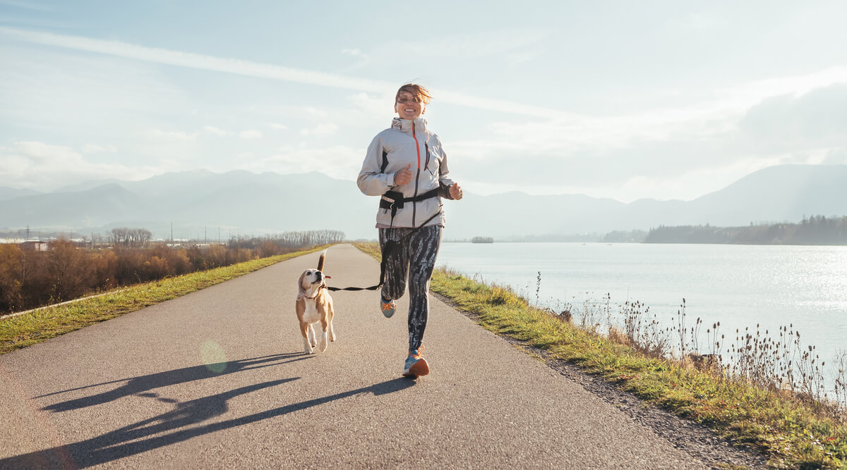 woman jogging with dog