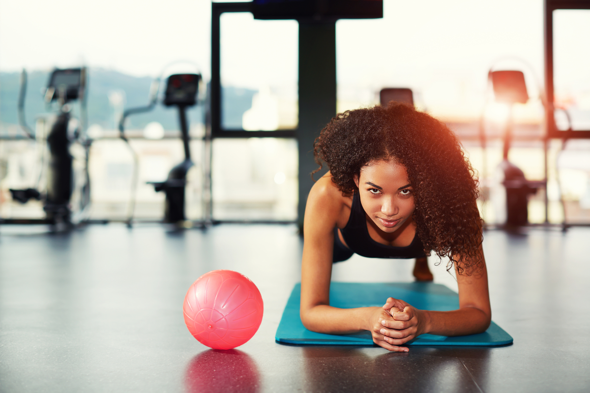 young woman doing a plank