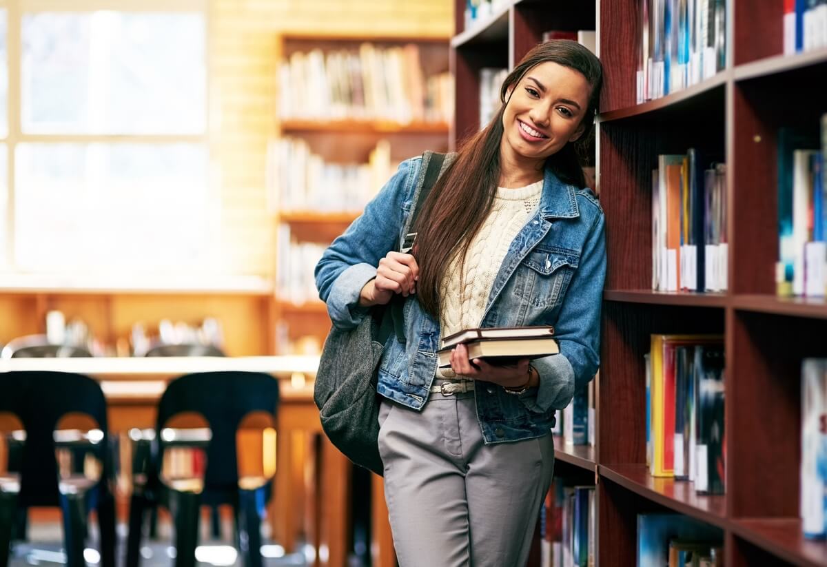 young woman studying in library