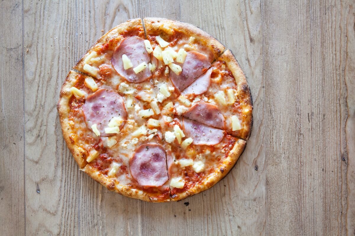 Shutterstock: Hawaiian Pizza on Wooden Background