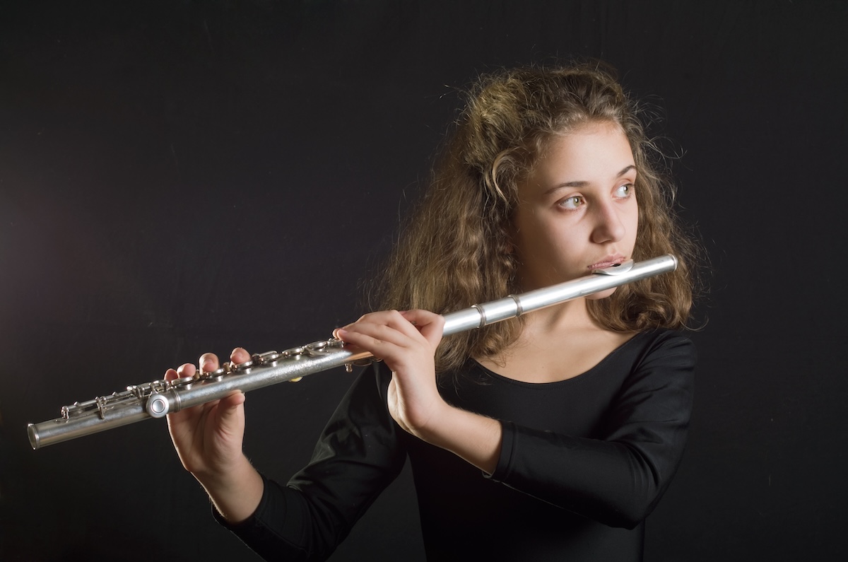 Shutterstock: Girl Playing Flute
