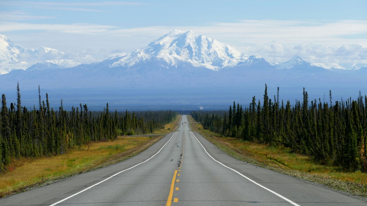 Unsplash: Alaskan mountains over long stretch of road by Joris Beugels
