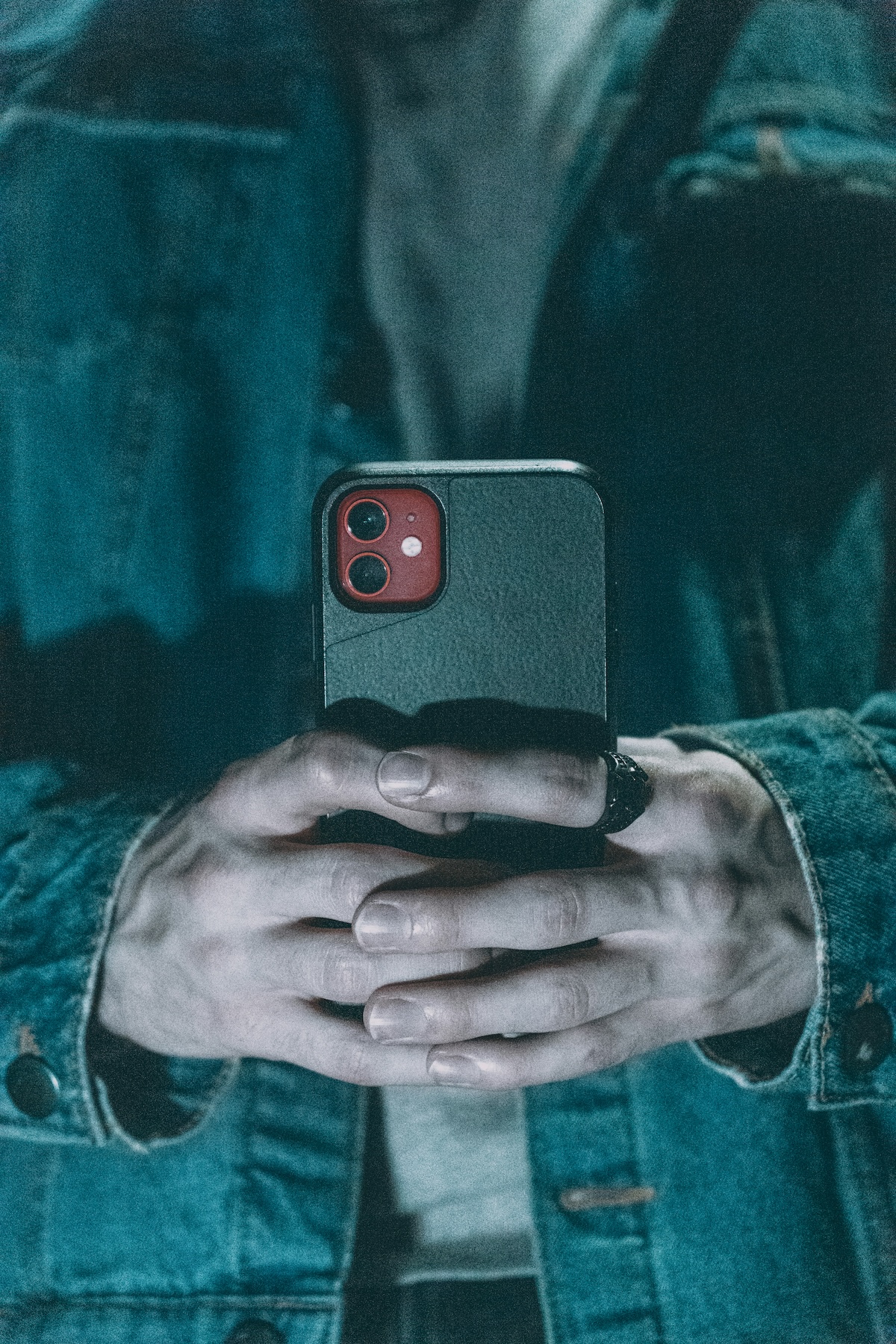 Unsplash: Grey hands with phone by Jacob Elliott