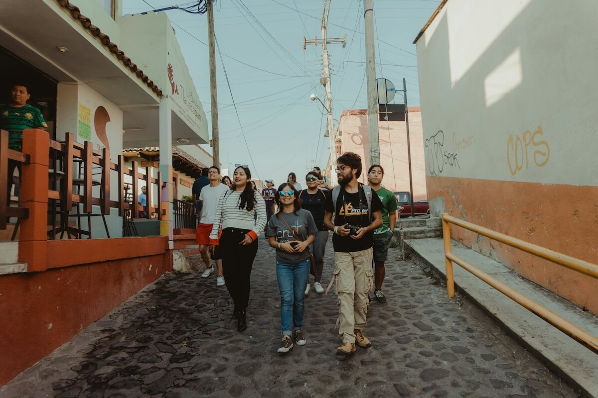 Unsplash: People waling through town be Cande Westh