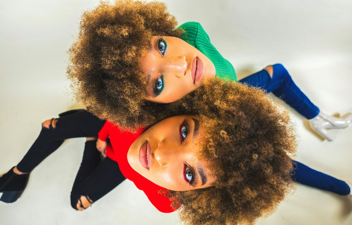 Unsplash: twins sisters with matching looks by Donald Oliver