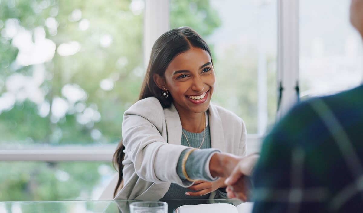 young woman giving a handshake