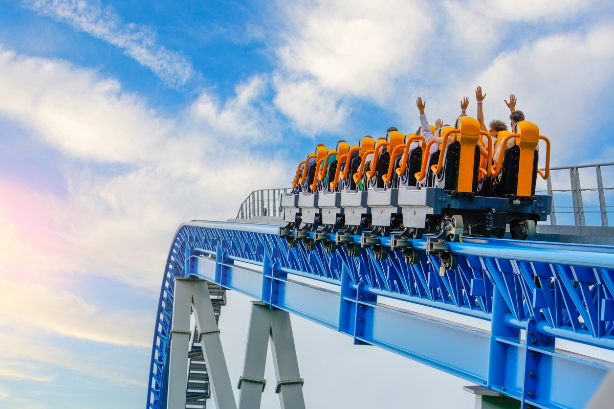 people going up a roller coaster