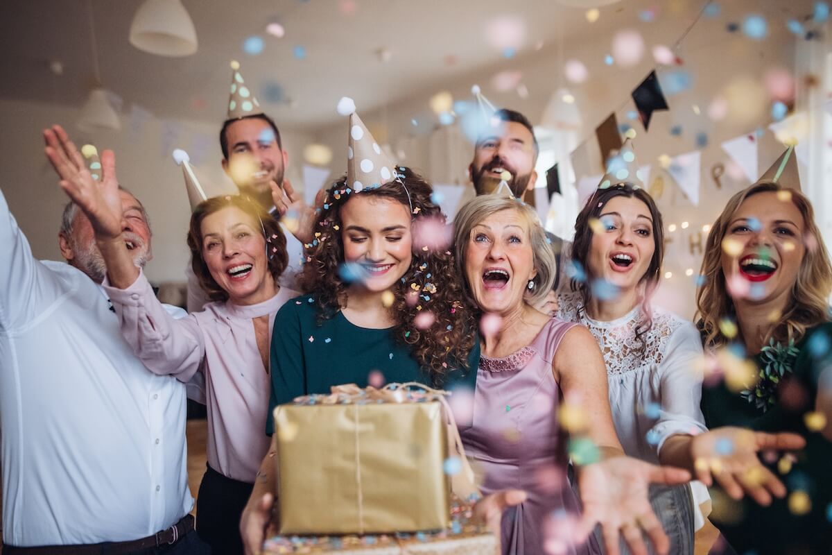 Shutterstock: A portrait of multigeneration family with presents on a indoor birthday party.