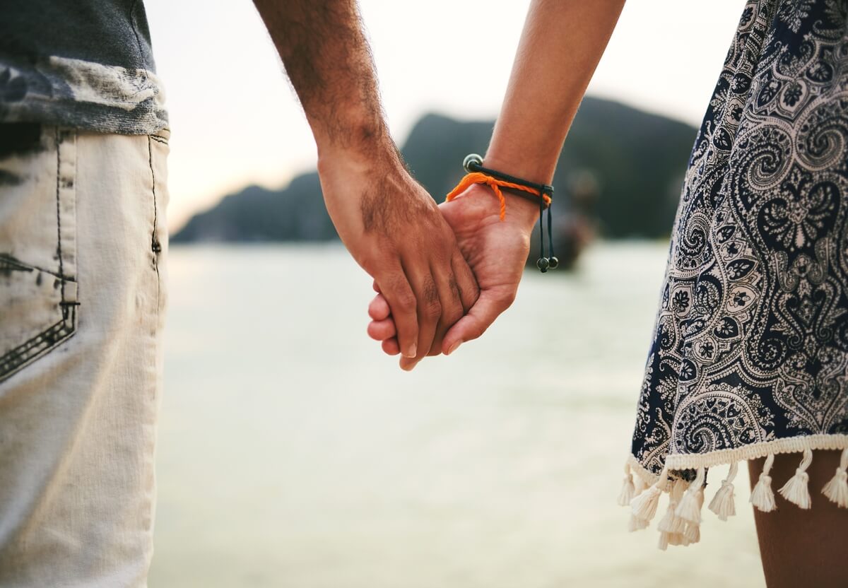 two people holding hands