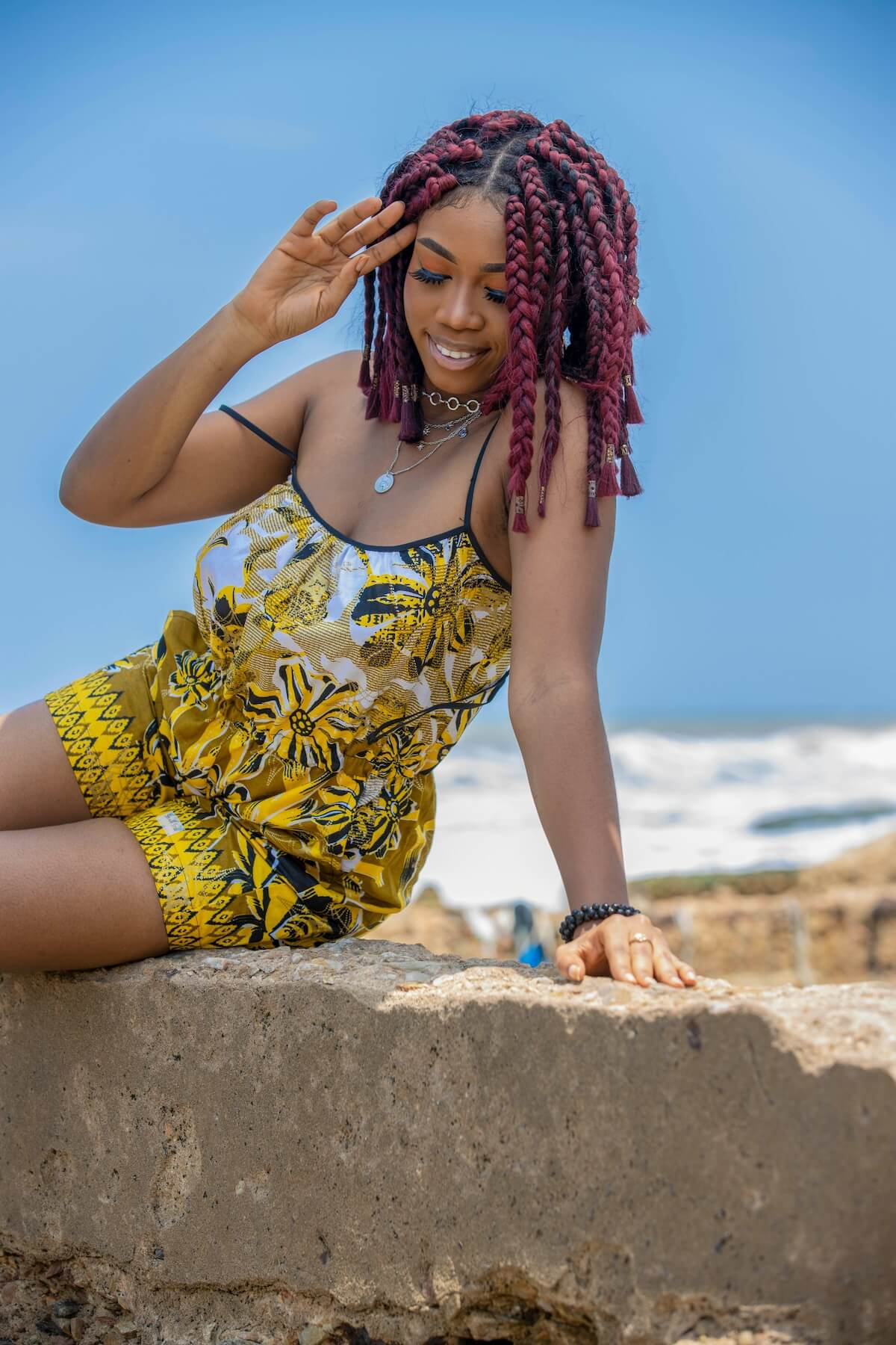 Unsplash: Woman in colorful romper by Delight Dzansi