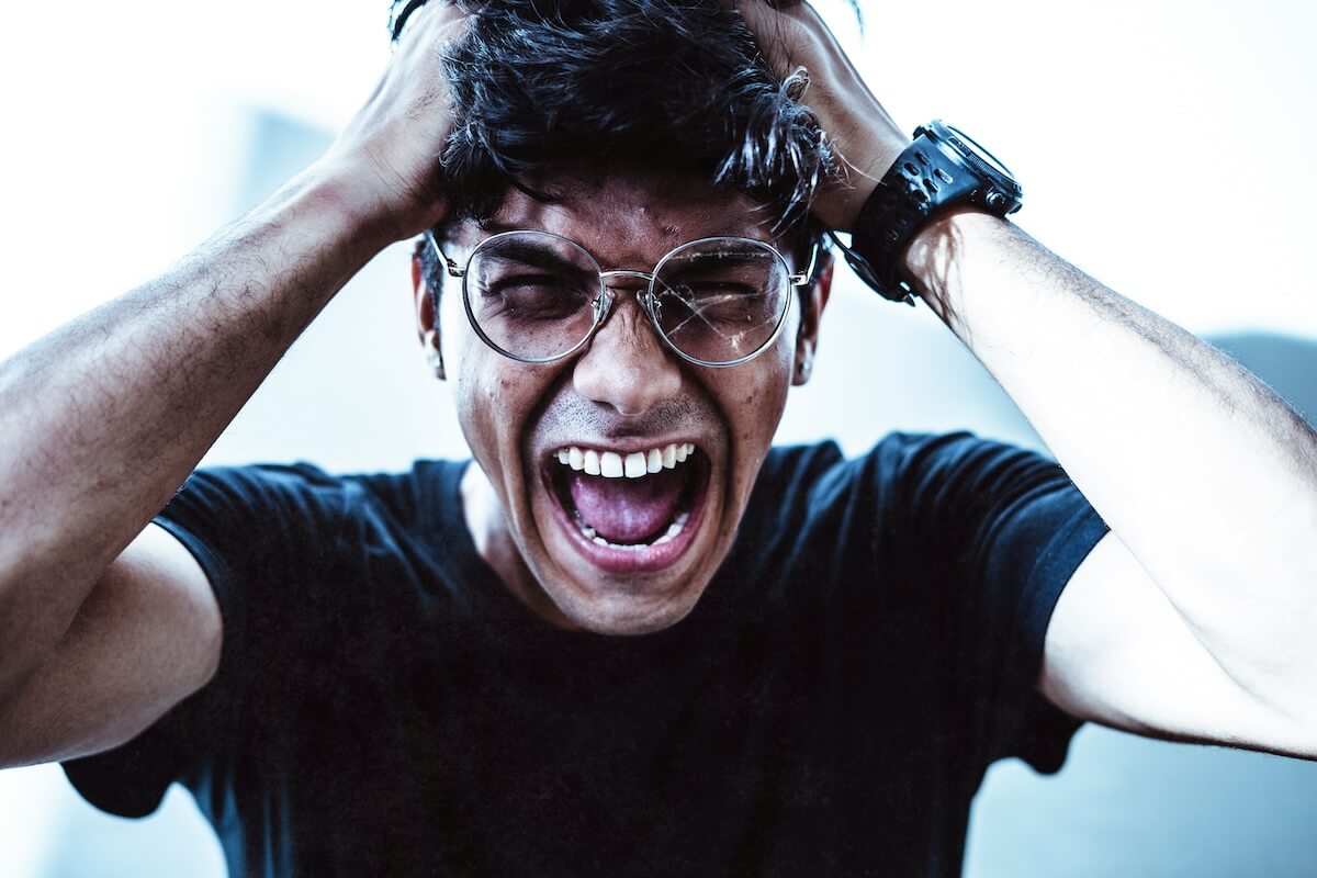 Unsplash: Angry man with broken glasses by Yogendra Singh