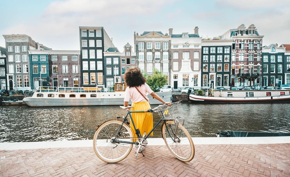 woman traveling on a bike in europe