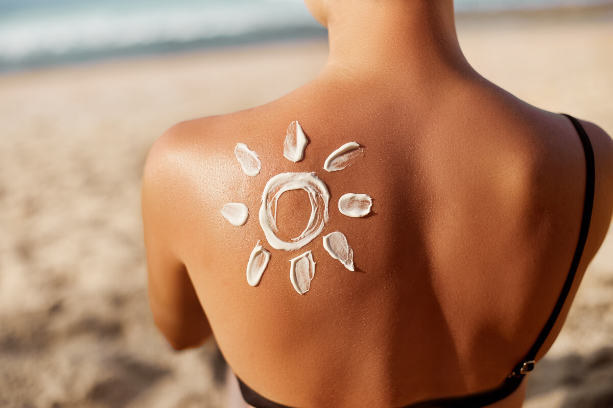woman with sun shaped sunscreen