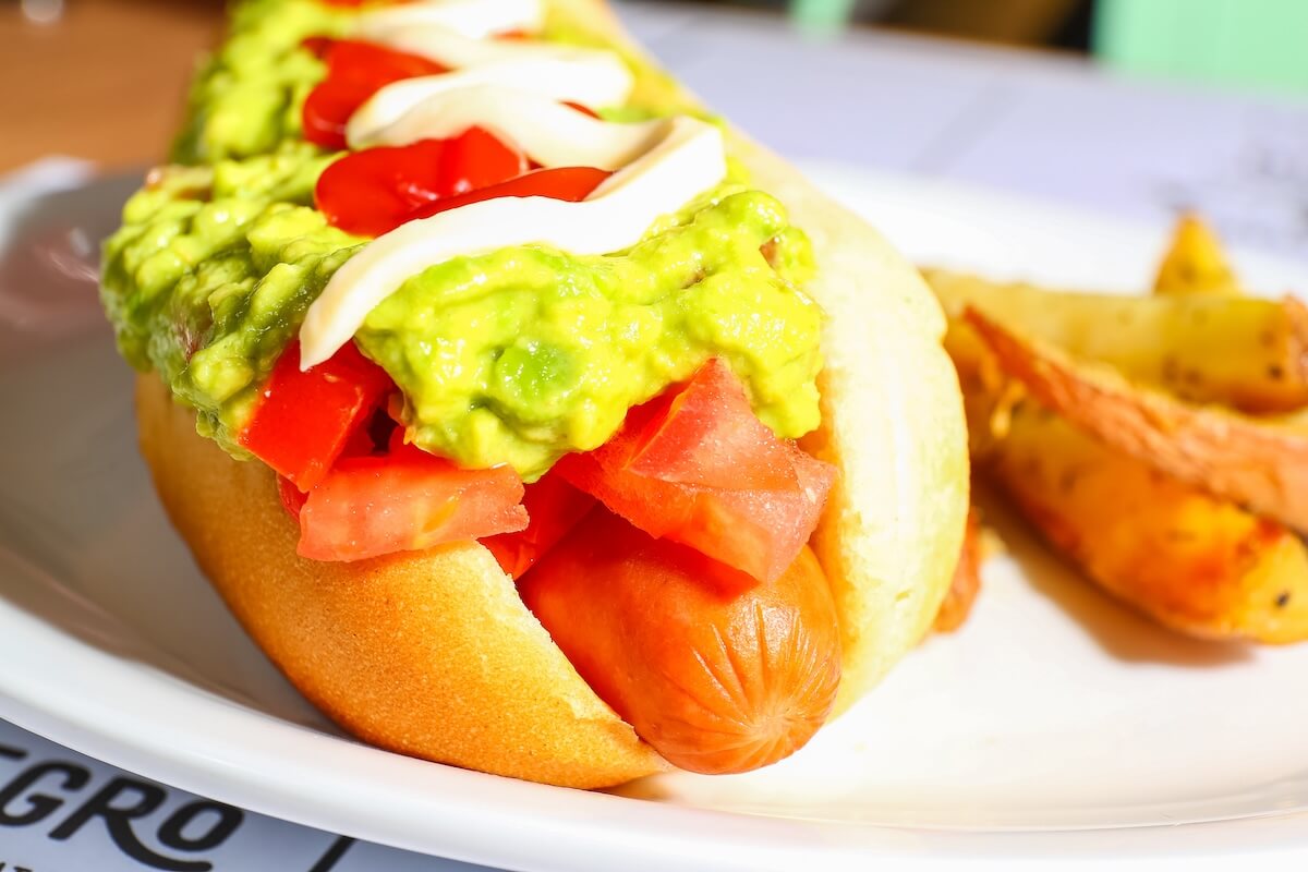 Shutterstock: hotdog as it is served in chile with avocado and tomato