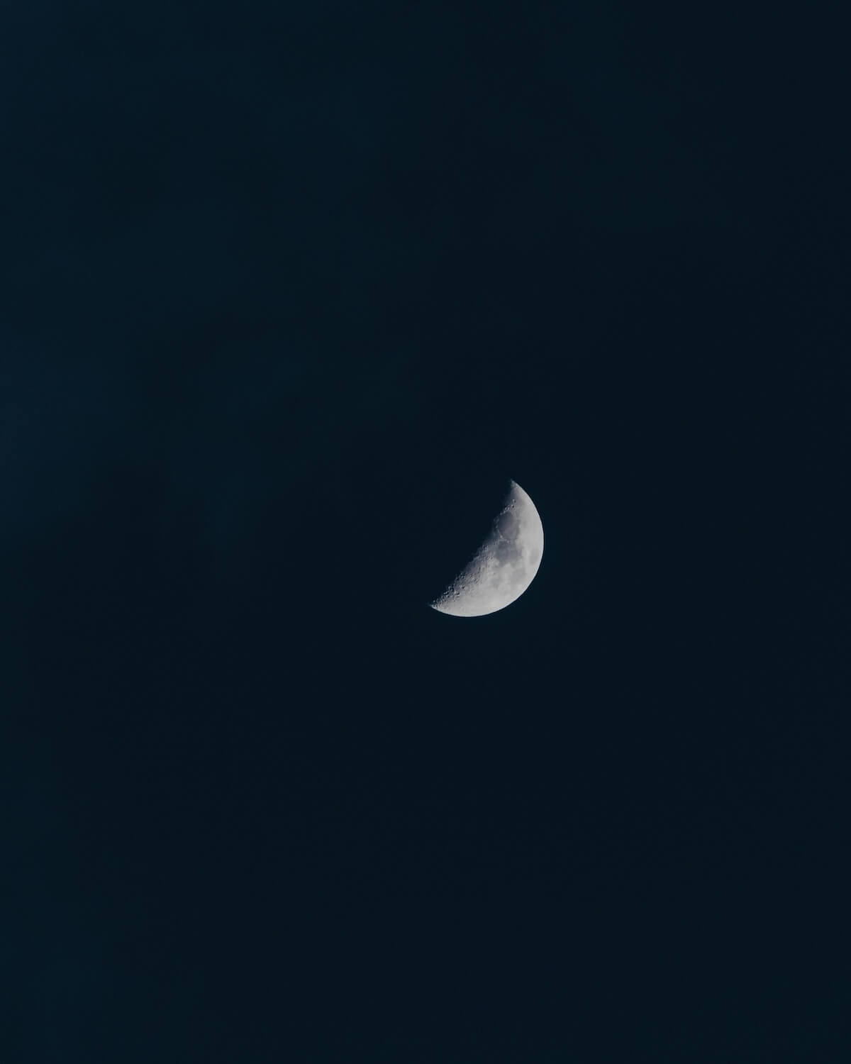 Unsplash: First quarter moon by Ines Alvarez Fdez