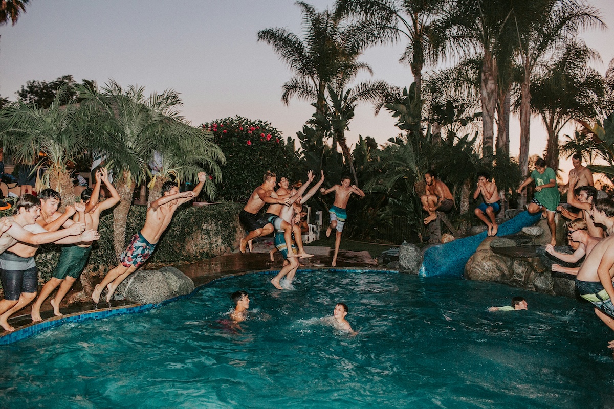 Unsplash: Friends Jumping Into Pool by Jed Villejo