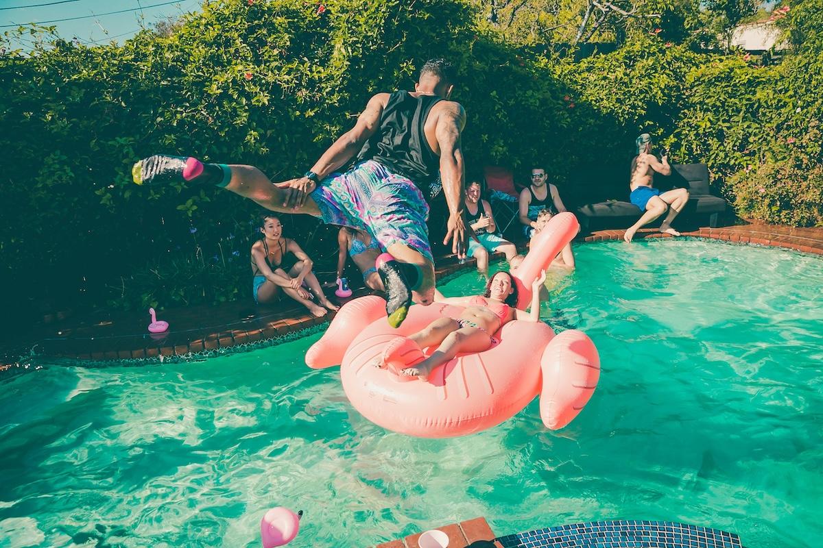 Unsplash: Jumping into pool flamingo party float by Jakob Owens