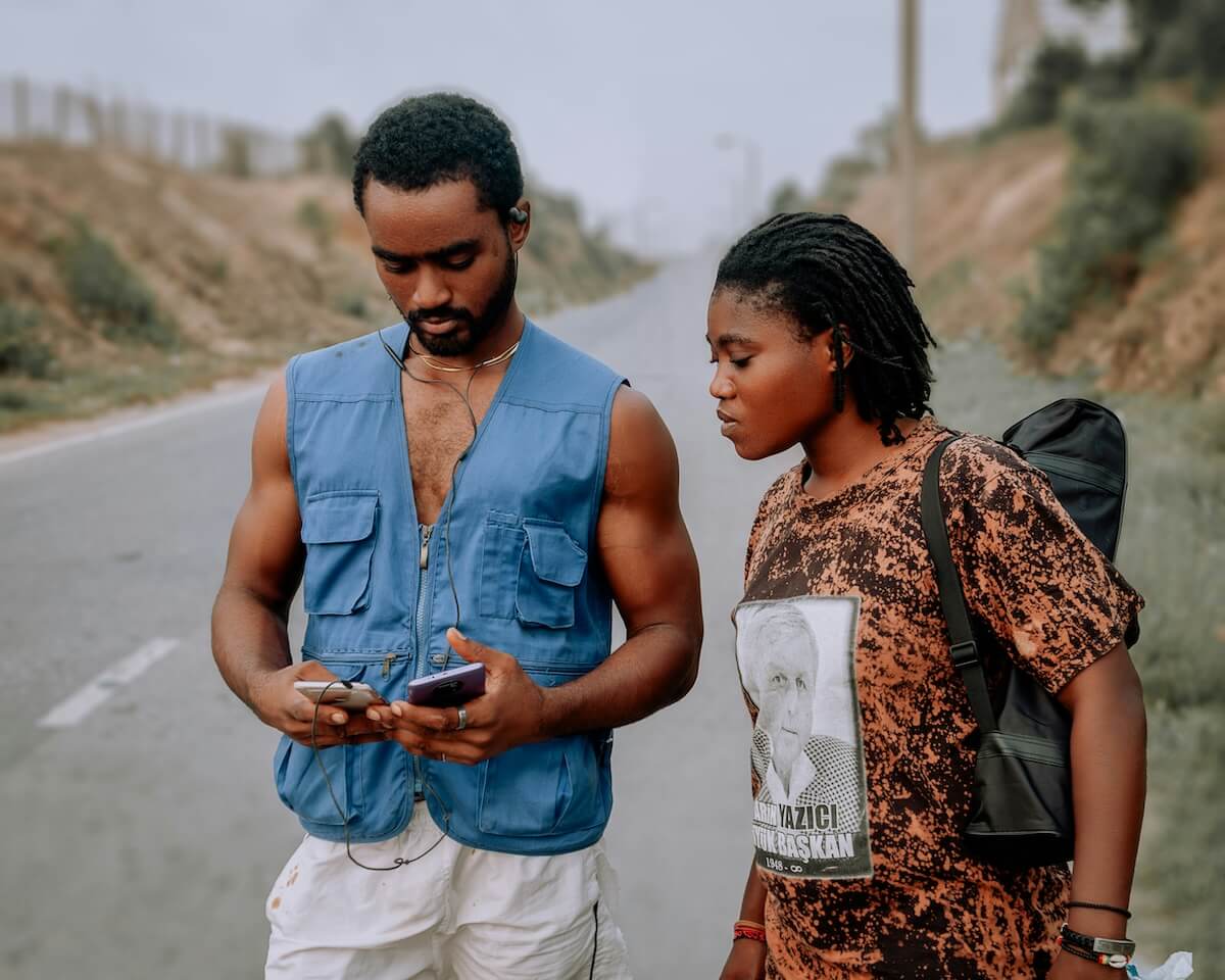 Unsplash: Man and woman syncing phones on run by Stephen Tetty Atsu