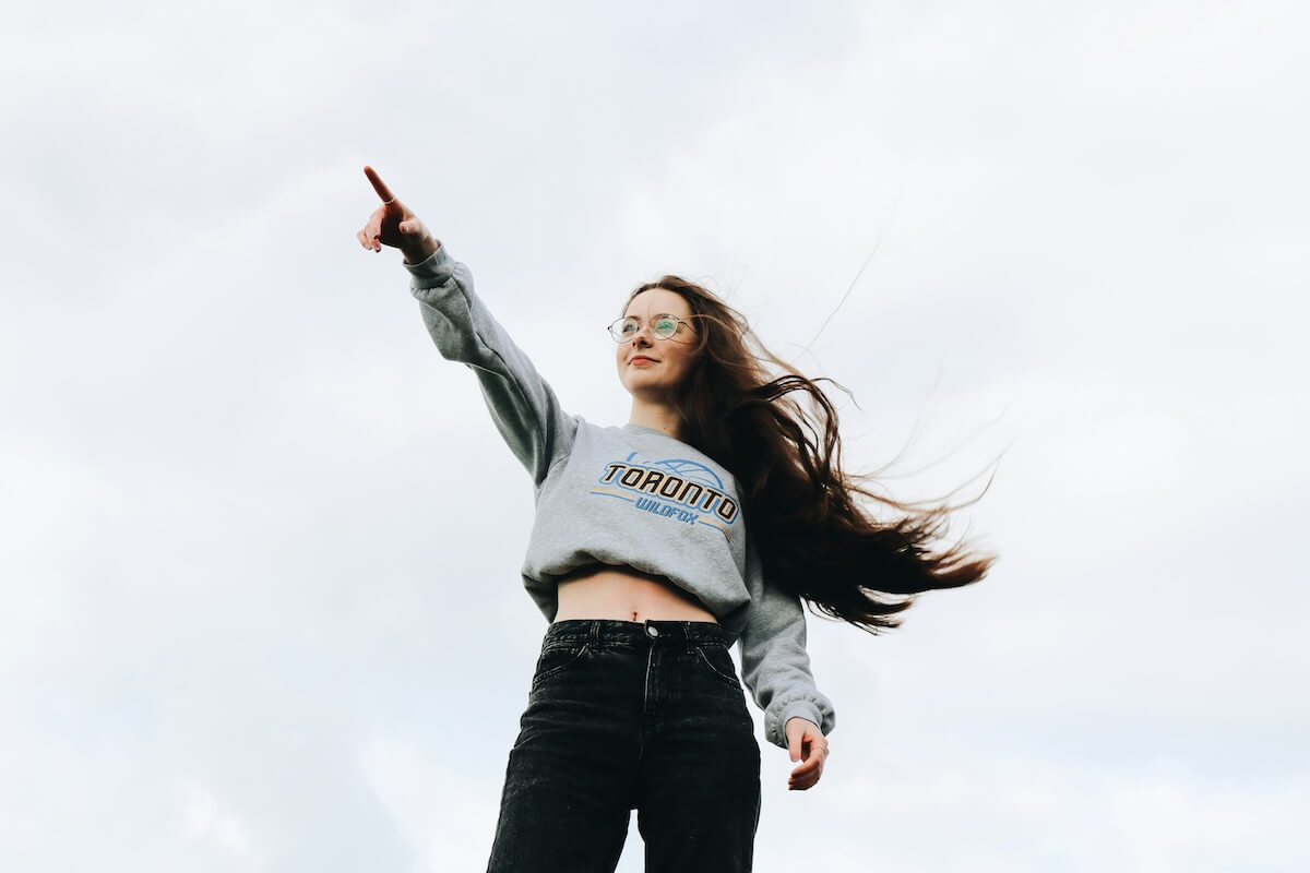 Unsplash: Woman pointing confidently by Thomas Kilbride