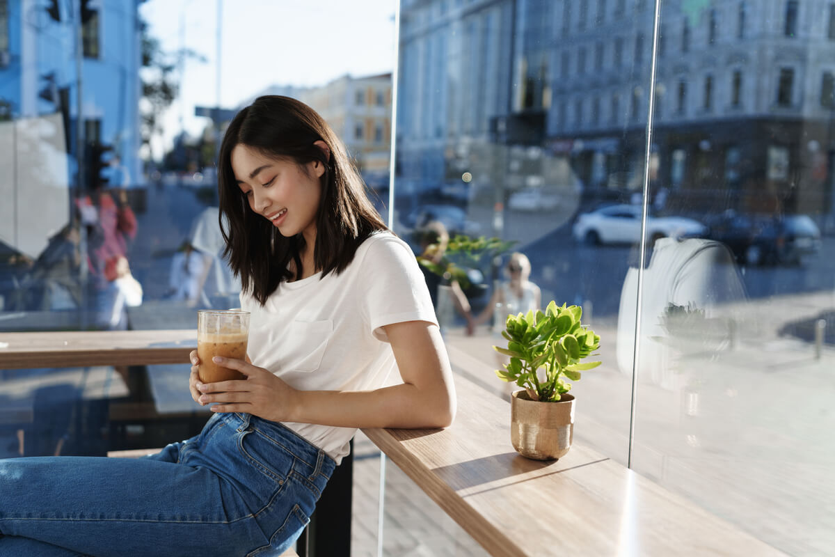 woman drinking coffee alone