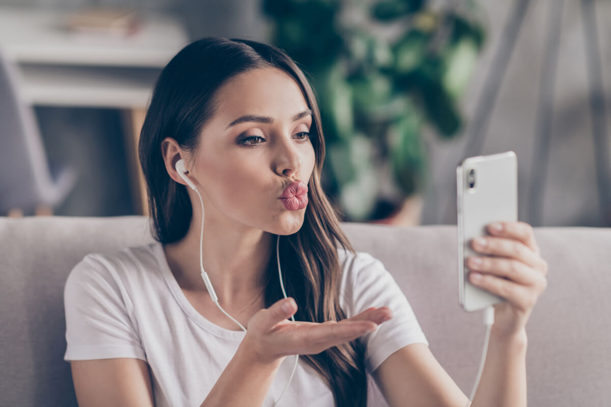 woman taking a silly selfie