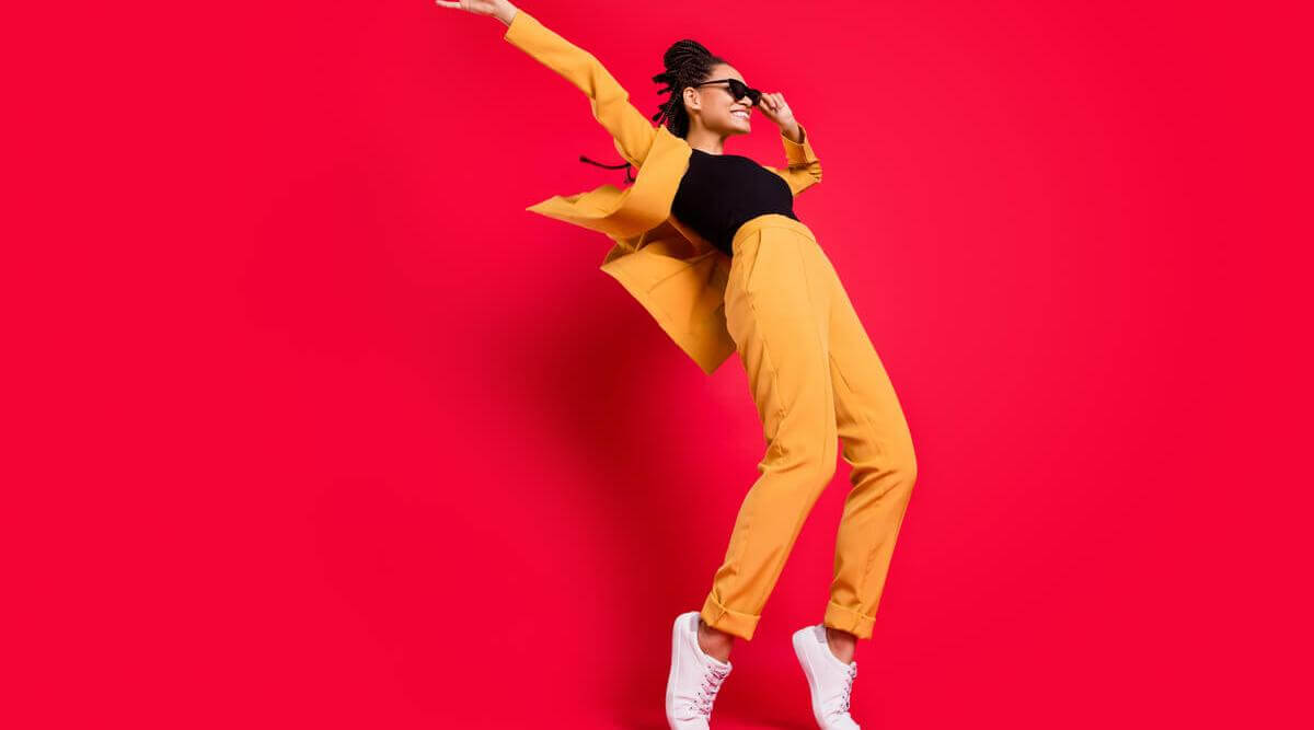 woman with yellow and black outfit featured