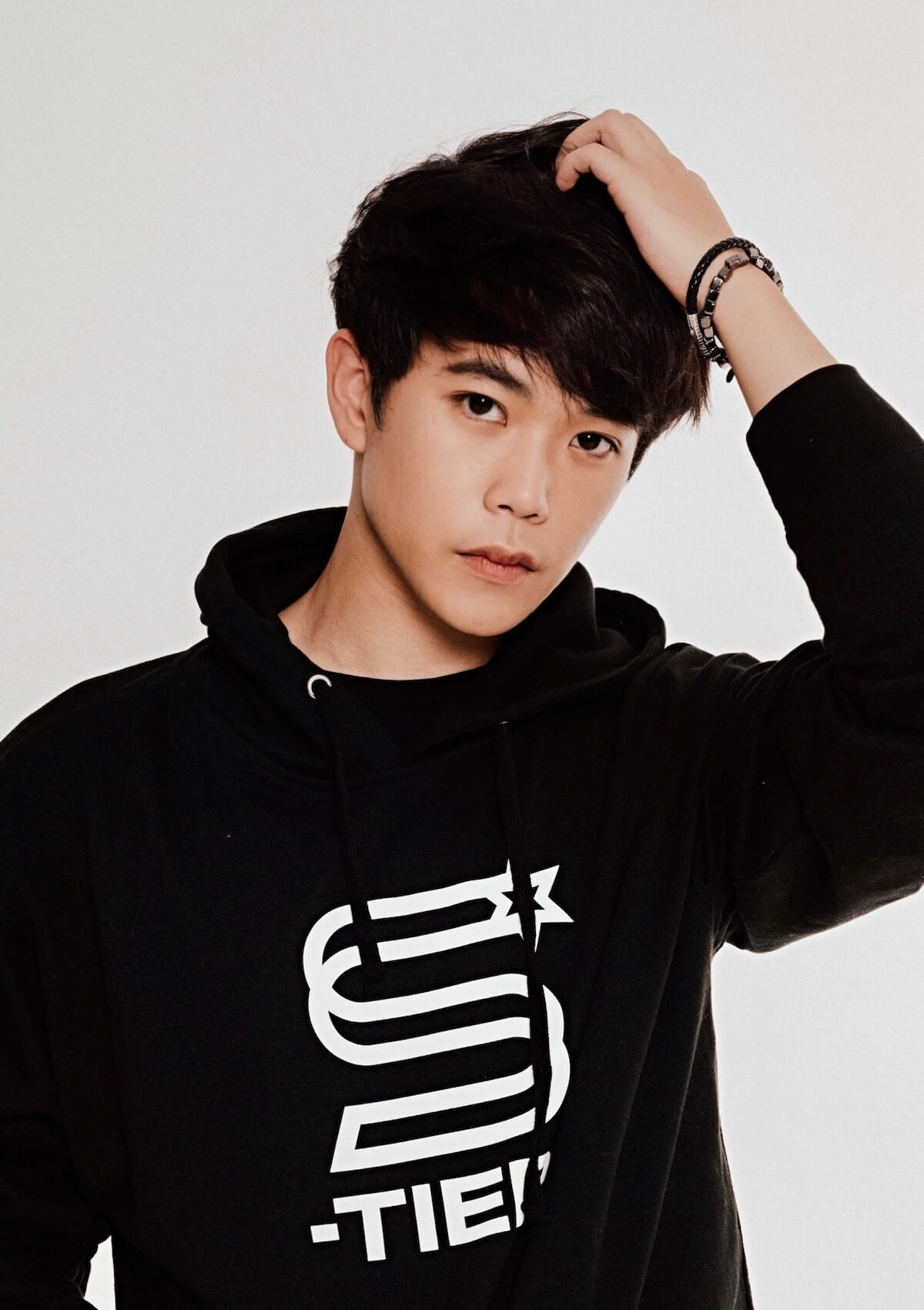 Aleks Le: headshot in hoodie