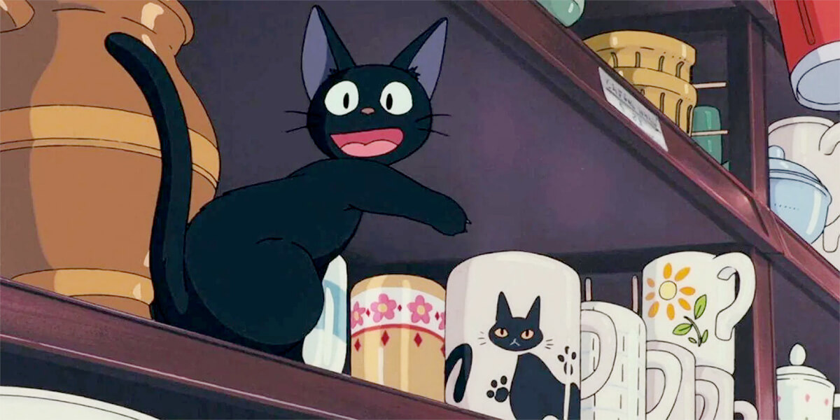 Kiki's Delivery Service: Jiji the cat pointing at mug