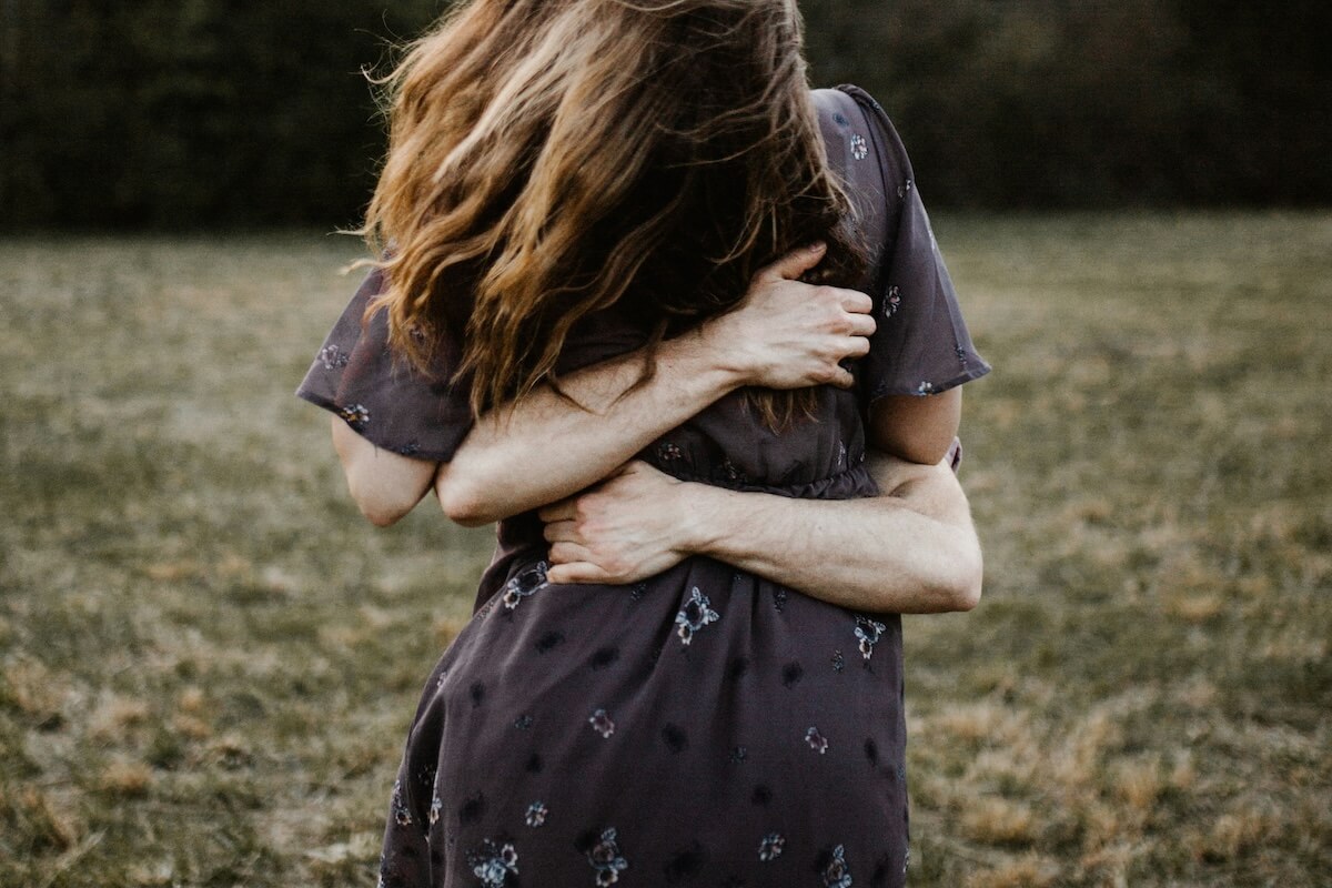 Unsplash: People hugging embrace by Andrew Neel