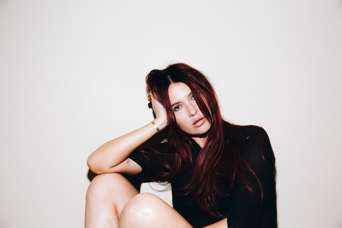 Mimi Webb sitting on the floor press image for Confessions album