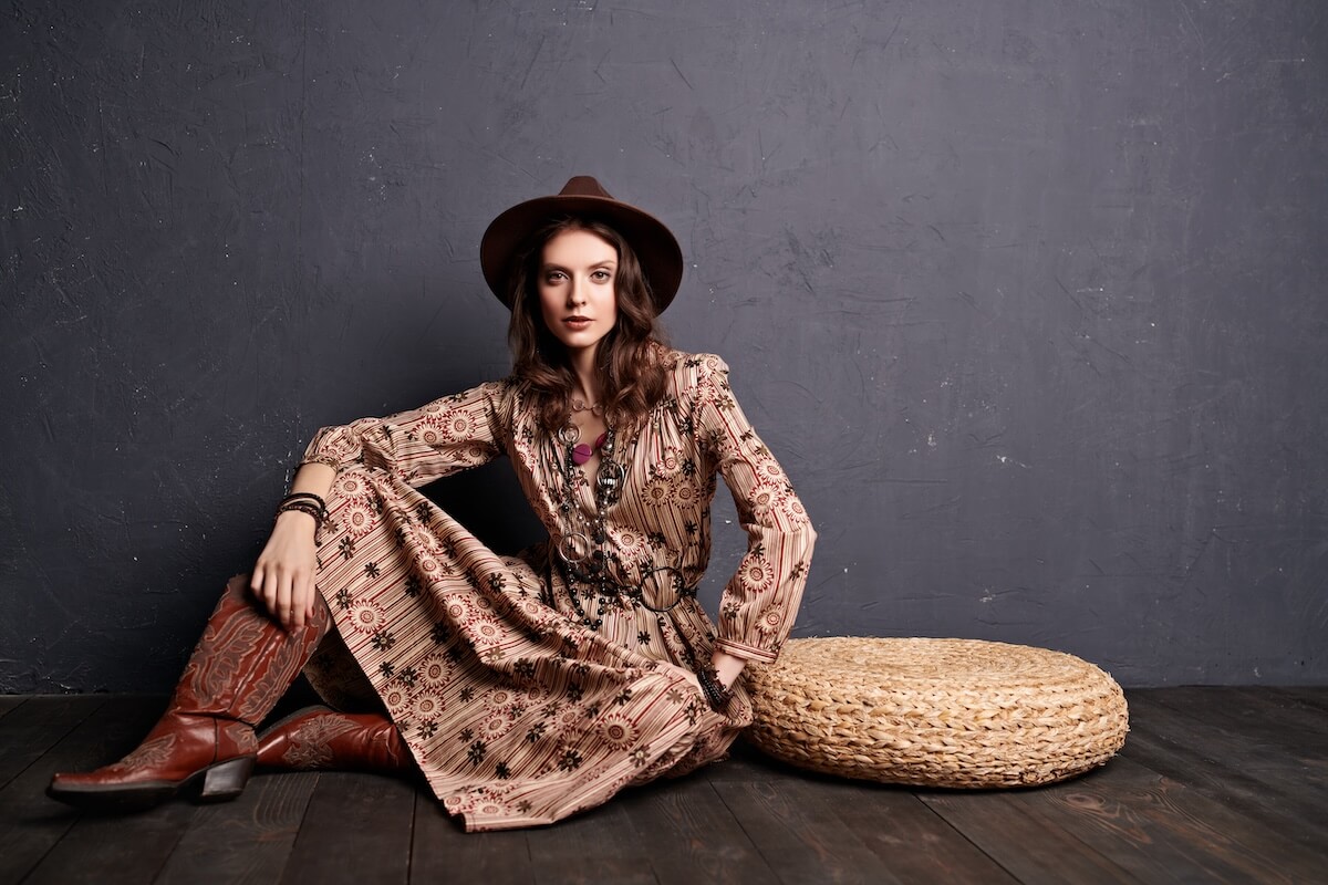 Shutterstock: Fashion shot of a gorgeous young woman in boho style dress and accessories posing at studio. Bohemian, modern hippie style.