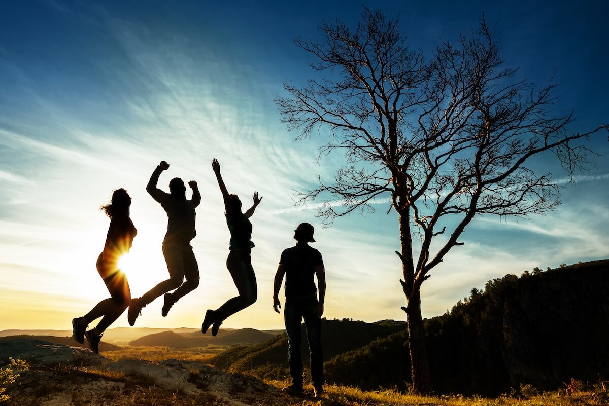 Shutterstock: Silhouette of people. People in jump. Friends have fun at sunset. Funny friends. Best friends. Friends traveling. Group of people at sunset. People have fun at sunset. Travelers at sunset