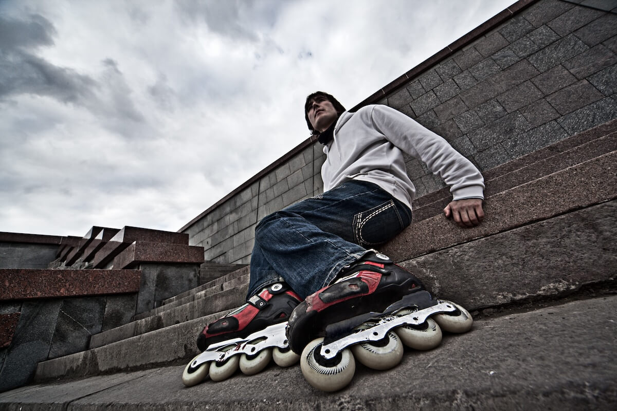 Shutterstock: Wide angle portrait of a serious rollerskating man